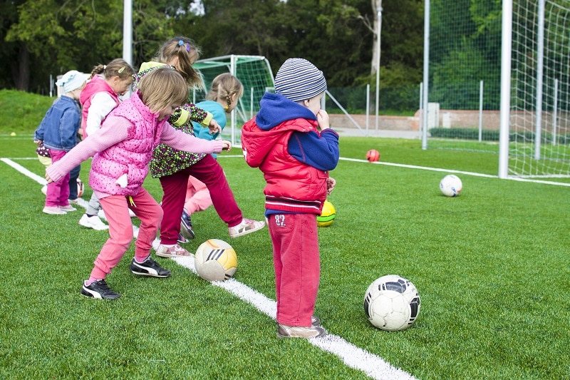 Kids shooting on football station